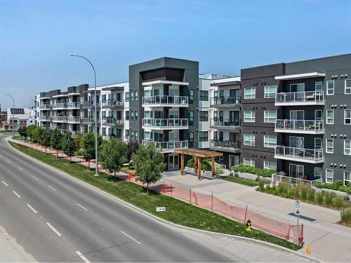 308-4150 Seton Drive Se, Calgary, AB - Outdoor With Balcony With Facade