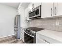 308-4150 Seton Drive Se, Calgary, AB  - Indoor Photo Showing Kitchen With Stainless Steel Kitchen 