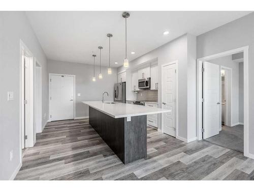 308-4150 Seton Drive Se, Calgary, AB - Indoor Photo Showing Kitchen With Upgraded Kitchen