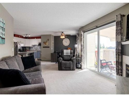 410-6000 Somervale Court Sw, Calgary, AB - Indoor Photo Showing Living Room