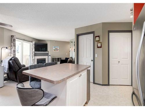 410-6000 Somervale Court Sw, Calgary, AB - Indoor With Fireplace