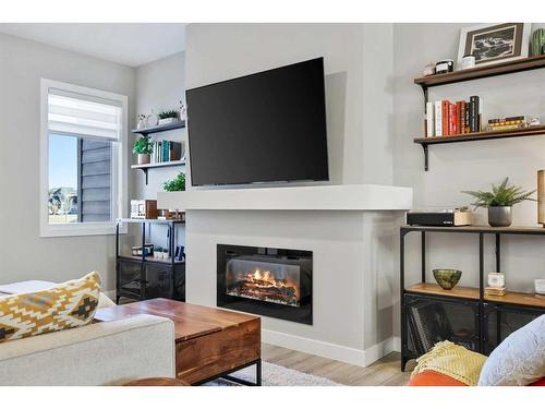 139 Wolf Creek Avenue Se, Calgary, AB - Indoor Photo Showing Living Room With Fireplace