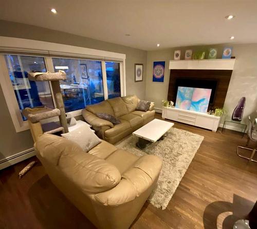 47 Fairview Drive Se, Calgary, AB - Indoor Photo Showing Living Room With Fireplace