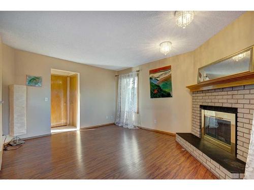 28 Hawkdale Close Nw, Calgary, AB - Indoor Photo Showing Living Room With Fireplace