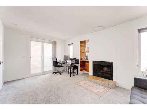 2408 56 Street Ne, Calgary, AB - Indoor Photo Showing Living Room With Fireplace