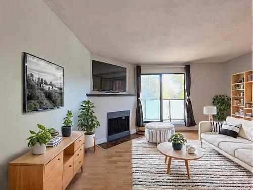 202-1821 17A Street Sw, Calgary, AB - Indoor Photo Showing Living Room With Fireplace