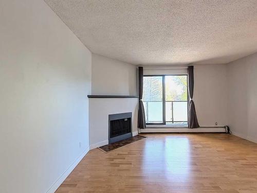 202-1821 17A Street Sw, Calgary, AB - Indoor With Fireplace