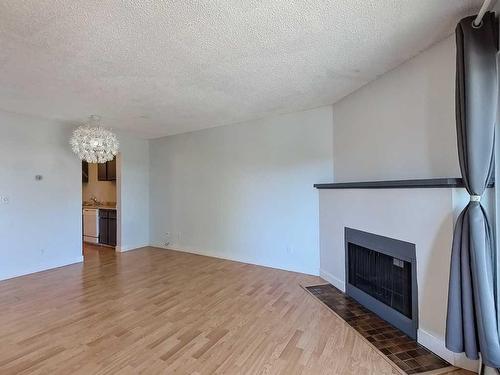 202-1821 17A Street Sw, Calgary, AB - Indoor Photo Showing Other Room With Fireplace