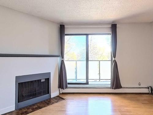 202-1821 17A Street Sw, Calgary, AB - Indoor With Fireplace