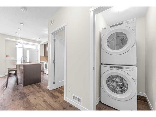 16-30 Shawnee Common Sw, Calgary, AB - Indoor Photo Showing Laundry Room