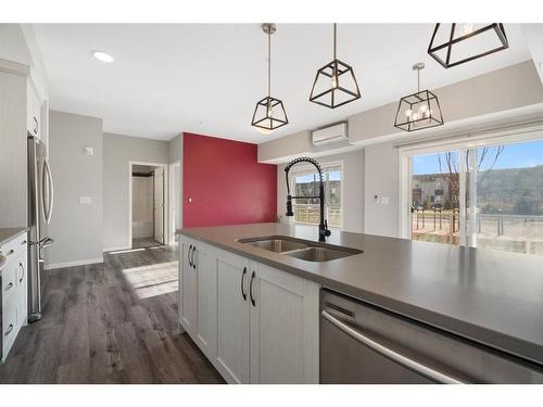 101-360 Harvest Hills Common Ne, Calgary, AB - Indoor Photo Showing Kitchen With Double Sink