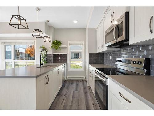 101-360 Harvest Hills Common Ne, Calgary, AB - Indoor Photo Showing Kitchen With Upgraded Kitchen