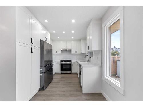 287 Hawk Wood Drive Nw, Calgary, AB - Indoor Photo Showing Kitchen With Stainless Steel Kitchen