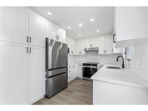 287 Hawk Wood Drive Nw, Calgary, AB - Indoor Photo Showing Kitchen With Stainless Steel Kitchen With Double Sink With Upgraded Kitchen