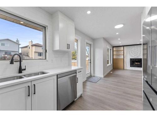 287 Hawk Wood Drive Nw, Calgary, AB - Indoor Photo Showing Kitchen With Double Sink