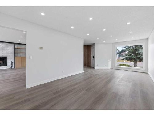 287 Hawk Wood Drive Nw, Calgary, AB - Indoor Photo Showing Living Room With Fireplace