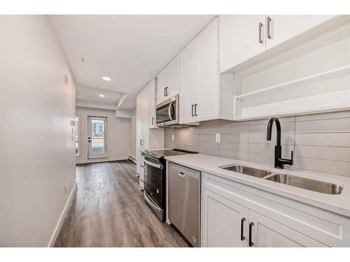 2112-350 Livingston Common Ne, Calgary, AB - Indoor Photo Showing Kitchen With Double Sink