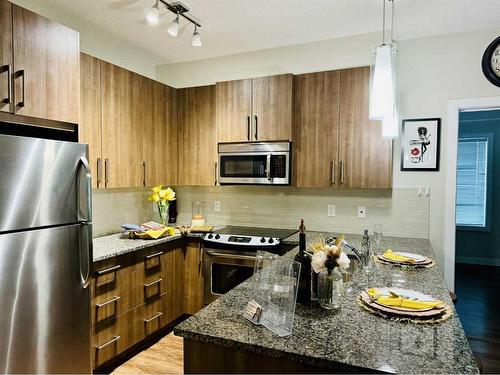 5-8 Sage Hill Terrace Nw, Calgary, AB - Indoor Photo Showing Kitchen With Upgraded Kitchen