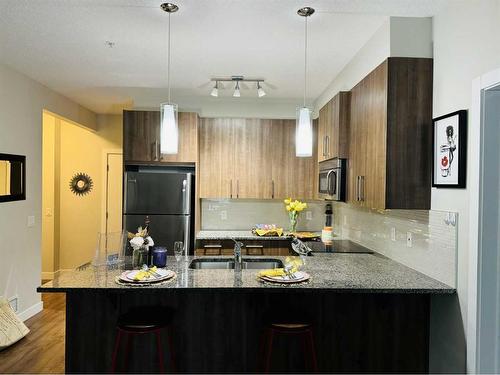 5-8 Sage Hill Terrace Nw, Calgary, AB - Indoor Photo Showing Kitchen With Double Sink With Upgraded Kitchen