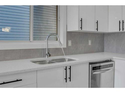 108 Martinwood Way Ne, Calgary, AB - Indoor Photo Showing Kitchen With Double Sink