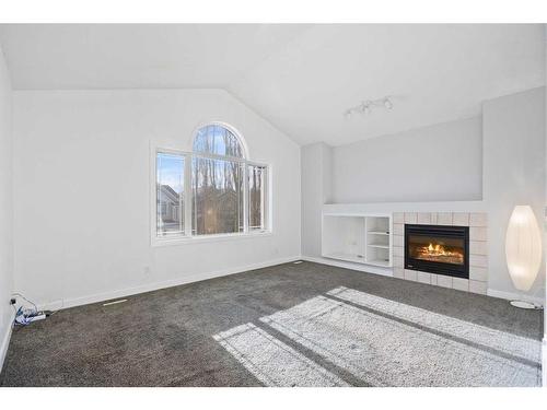 170 River Rock Place Se, Calgary, AB - Indoor Photo Showing Living Room With Fireplace