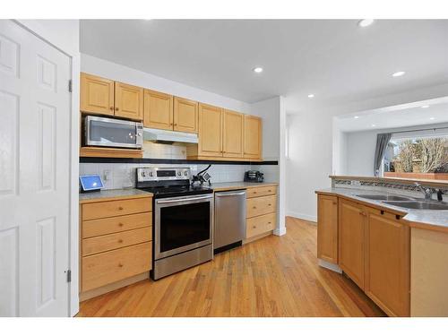 170 River Rock Place Se, Calgary, AB - Indoor Photo Showing Kitchen With Double Sink