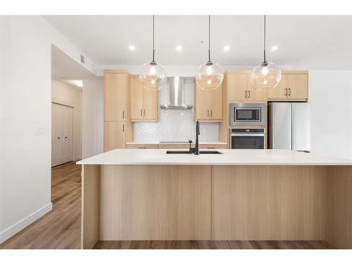 301-20 Sage Hill Walk Nw, Calgary, AB - Indoor Photo Showing Kitchen With Upgraded Kitchen