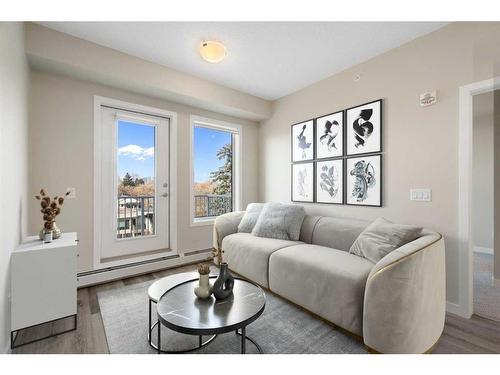 320-1605 17 Street Se, Calgary, AB - Indoor Photo Showing Living Room