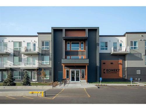 320-1605 17 Street Se, Calgary, AB - Outdoor With Balcony With Facade