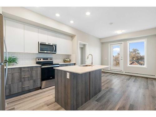 320-1605 17 Street Se, Calgary, AB - Indoor Photo Showing Kitchen With Stainless Steel Kitchen With Upgraded Kitchen