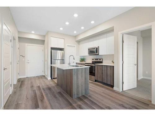 320-1605 17 Street Se, Calgary, AB - Indoor Photo Showing Kitchen With Stainless Steel Kitchen With Upgraded Kitchen