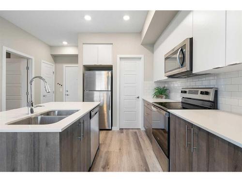 320-1605 17 Street Se, Calgary, AB - Indoor Photo Showing Kitchen With Stainless Steel Kitchen With Double Sink With Upgraded Kitchen