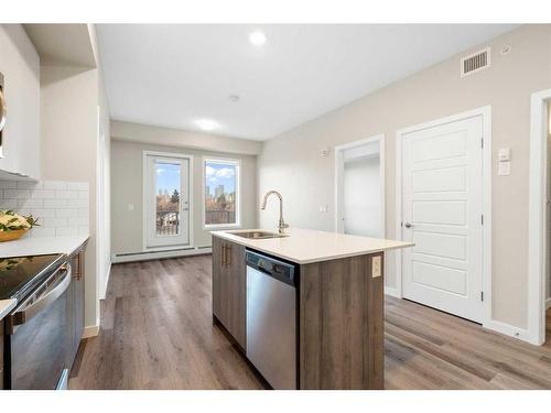 320-1605 17 Street Se, Calgary, AB - Indoor Photo Showing Kitchen With Stainless Steel Kitchen With Upgraded Kitchen