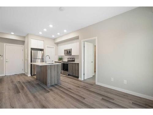 320-1605 17 Street Se, Calgary, AB - Indoor Photo Showing Kitchen With Stainless Steel Kitchen With Upgraded Kitchen