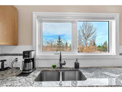 38-7 Westland Road, Okotoks, AB - Indoor Photo Showing Kitchen With Double Sink