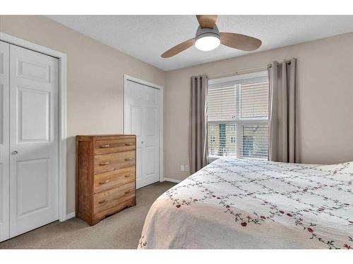 38-7 Westland Road, Okotoks, AB - Indoor Photo Showing Bedroom