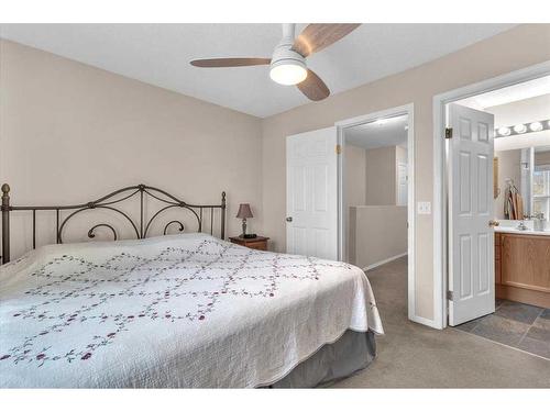 38-7 Westland Road, Okotoks, AB - Indoor Photo Showing Bedroom