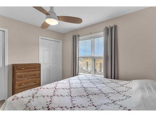 38-7 Westland Road, Okotoks, AB - Indoor Photo Showing Bedroom