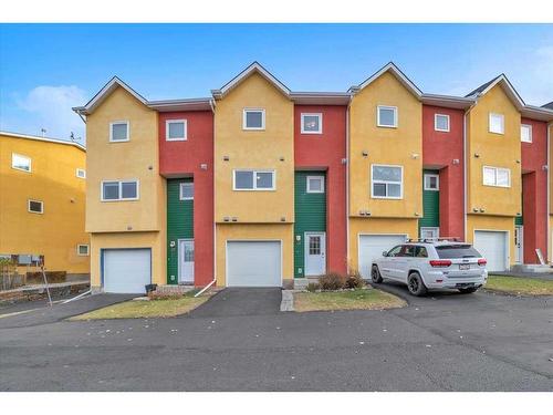 38-7 Westland Road, Okotoks, AB - Outdoor With Facade