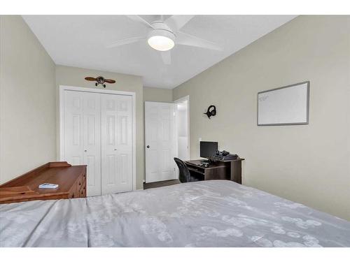 38-7 Westland Road, Okotoks, AB - Indoor Photo Showing Bedroom