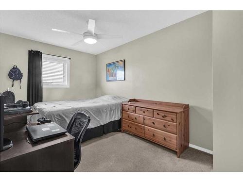 38-7 Westland Road, Okotoks, AB - Indoor Photo Showing Bedroom