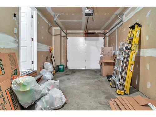 38-7 Westland Road, Okotoks, AB - Indoor Photo Showing Garage