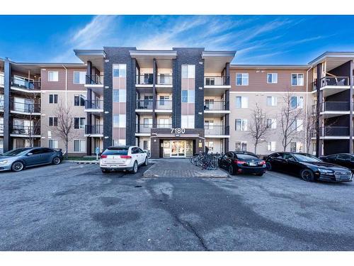 305-7180 80 Avenue Ne, Calgary, AB - Outdoor With Balcony With Facade