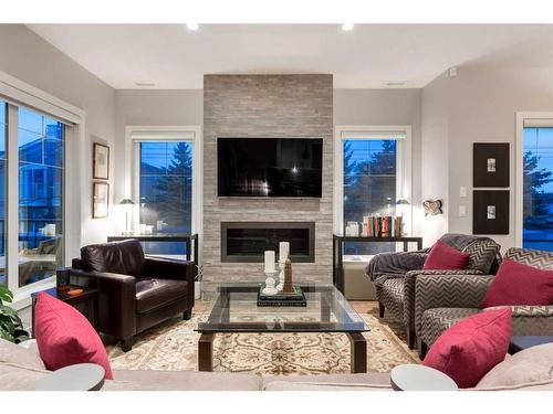 4-2432 30 Street Sw, Calgary, AB - Indoor Photo Showing Living Room With Fireplace