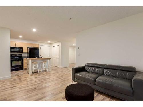 1232-2395 Eversyde Avenue Sw, Calgary, AB - Indoor Photo Showing Living Room