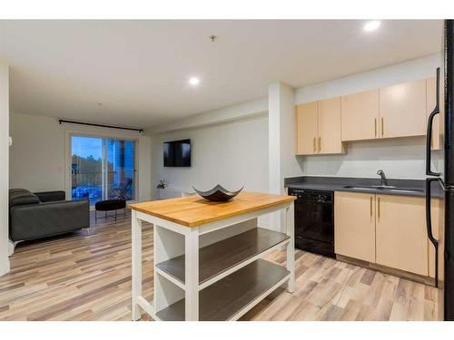 1232-2395 Eversyde Avenue Sw, Calgary, AB - Indoor Photo Showing Kitchen With Double Sink