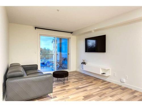 1232-2395 Eversyde Avenue Sw, Calgary, AB - Indoor Photo Showing Living Room