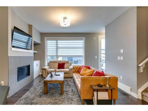 2-2626 24A Street Sw, Calgary, AB - Indoor Photo Showing Living Room With Fireplace