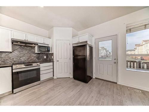 1501-703 Luxstone Square Sw, Airdrie, AB - Indoor Photo Showing Kitchen