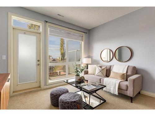 9-148 Rockyledge View Nw, Calgary, AB - Indoor Photo Showing Living Room